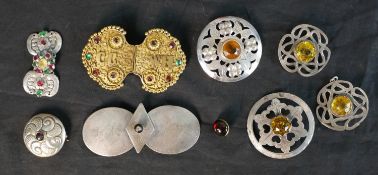 A collection of Danish traditional folk costume buckles, brooches and pendants, including three