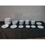 Assorted contemporary Chinese blue and white rice and floral design porcelain plates and saucers.