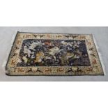 A 20th century North Indian Kashmir silk rug depicting a men on horseback slaying animals within a