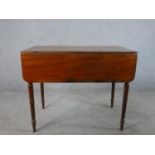 A George III mahogany drop leaf Pembroke table raised on turned supports. H.72 W.90 D.94cm (
