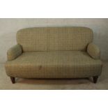 A 19th century Howard style two seater sofa, upholstered in Harris tweed style fabric, raised on