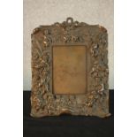 A late 19th/early 20th, possibly Italian cast bronze easel picture frame, with figural and putti