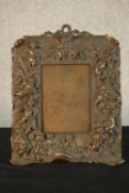 A late 19th/early 20th, possibly Italian cast bronze easel picture frame, with figural and putti