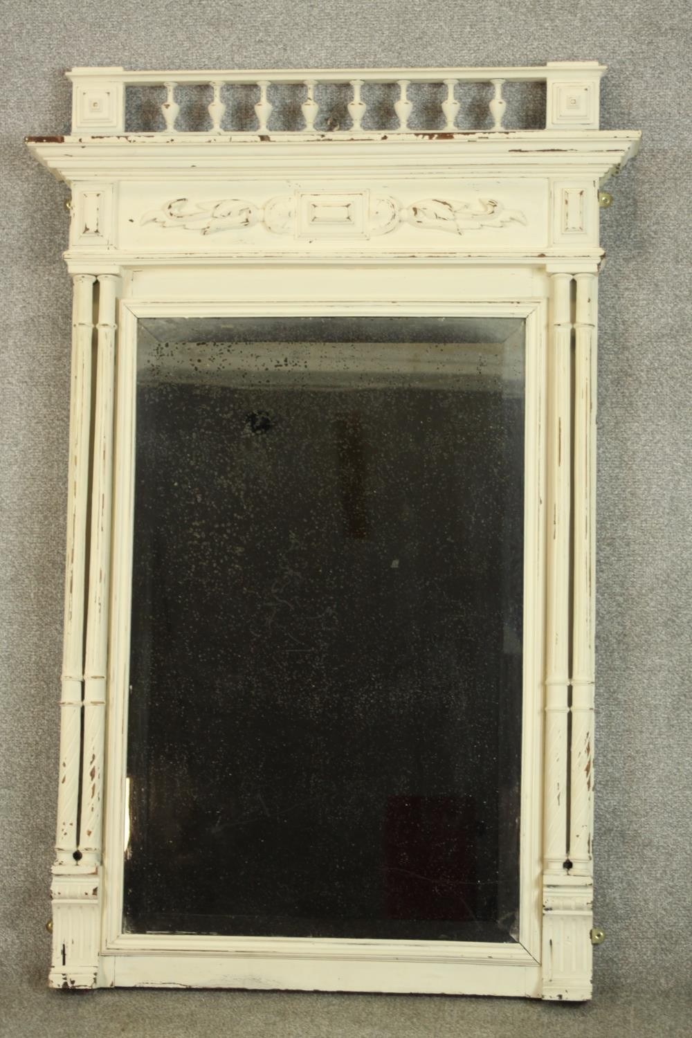 A 19th century white painted mahogany framed carved wall mirror. H.118 W.83cm.