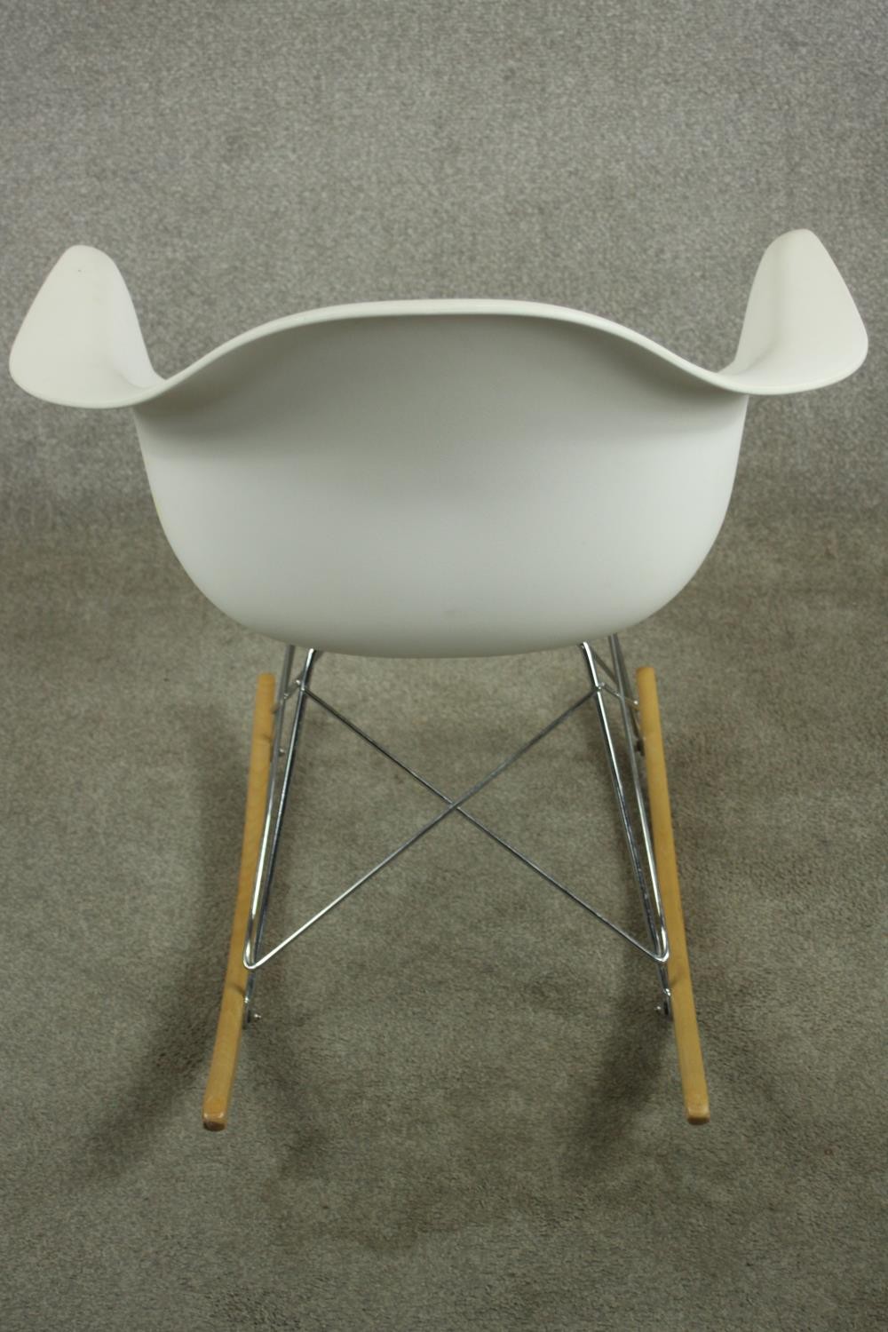 After Charles and Ray Eames a RAR rocking armchair with white plastic bucket seat, raised on - Image 5 of 7