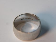 A textured effect 18 carat white gold ring. Size O 1/2, 9.6g gross weight