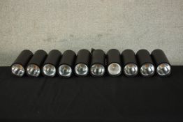 A set of ten cylindrical wall mounted electric studio/picture lights. H.23 W.8 D.22cm each