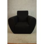 A contemporary low upholstered armchair. H.78 W.82 D.82cm.