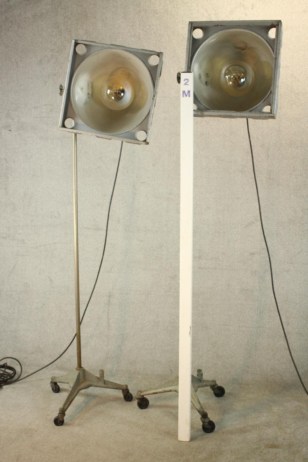 A pair of 20th century pair of industrial floor standing lamps, raised on three splayed supports - Image 2 of 14