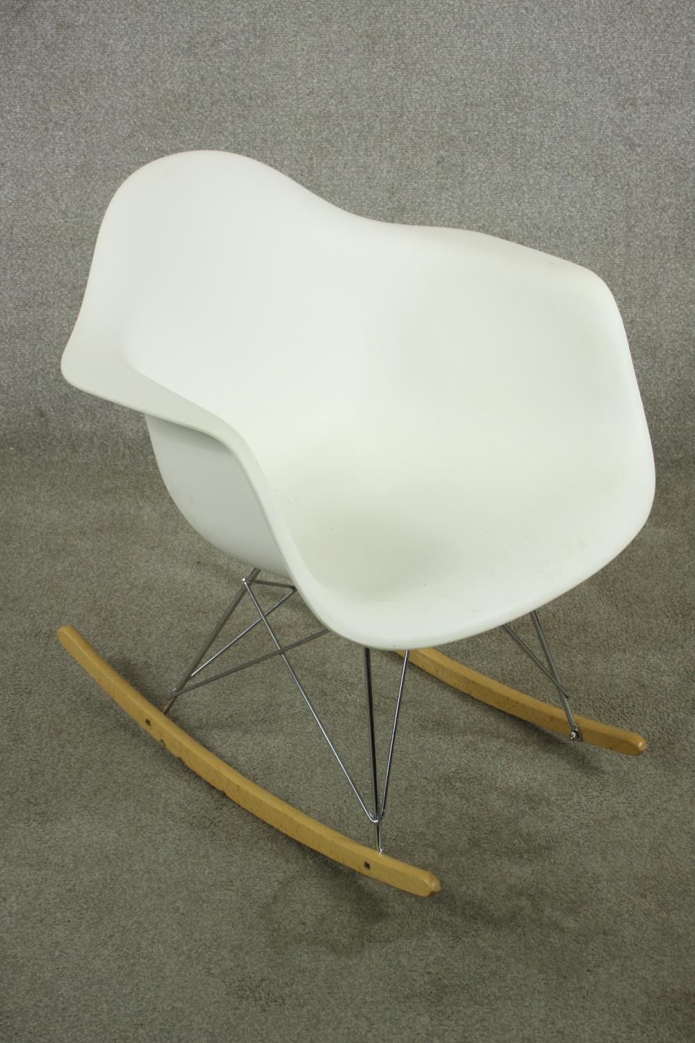 After Charles and Ray Eames a RAR rocking armchair with white plastic bucket seat, raised on - Image 3 of 7