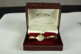 A ladies yellow metal cased ladies Rotary wristwatch with a 9 carat yellow gold strap, the dial with