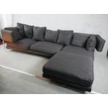 A contemporary grey upholstered L shaped modular settee raised on chrome plated supports. H.73 W.297