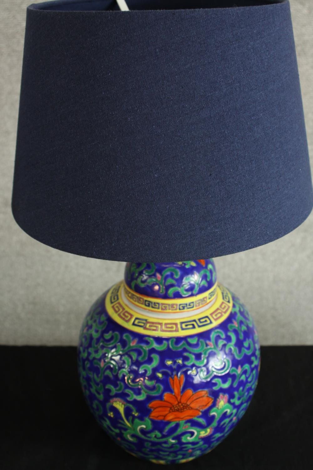 A contemporary pair of Chinese porcelain table lamps, with scroll and floral decoration. H.50 Dia. - Image 5 of 7