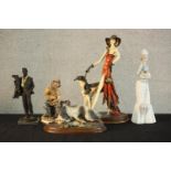 Four porcelain figures, including an Art Deco style lady with Borzoi dog by A Santini, a Capodimonte