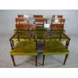 A set of eight Regency mahogany framed dining chairs with pierced bar back, green upholstered