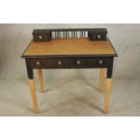 A late 20th painted and stained beech two drawer ladies writing desk, raised on tapering supports.