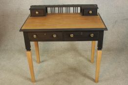 A late 20th painted and stained beech two drawer ladies writing desk, raised on tapering supports.