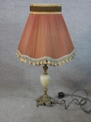 A 20th century gilt metal mounted and onyx baluster shaped table lamp. H.75 W.42 D.38cm