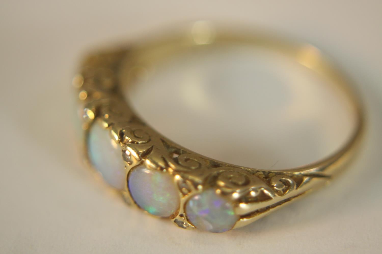 A 9ct carat yellow gold carved half hoop five stone Opal and diamond ring. Set with five round - Image 4 of 10