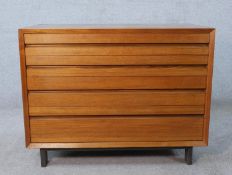 A mid 20th century Danish Rosewood chest of four graduating drawers designed by Paul Cadovius,