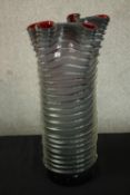 A mid 20th century ribbed Murano glass handkerchief vase, the clear glass exterior inset with a