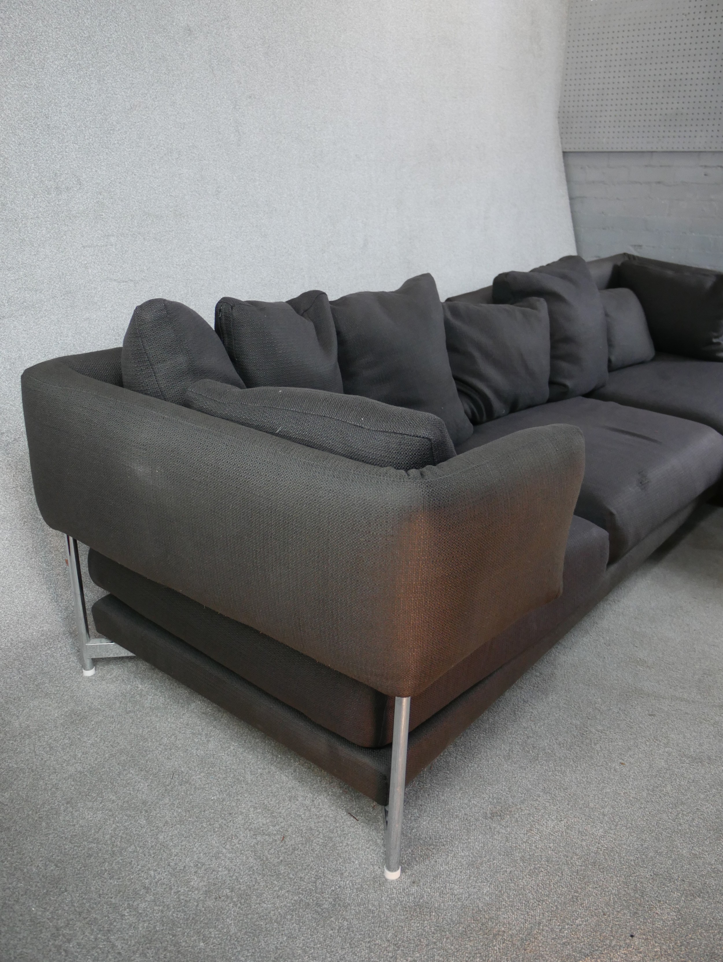 A contemporary grey upholstered L shaped modular settee raised on chrome plated supports. H.73 W.297 - Image 6 of 8