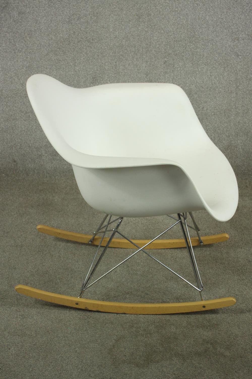 After Charles and Ray Eames a RAR rocking armchair with white plastic bucket seat, raised on - Image 4 of 7