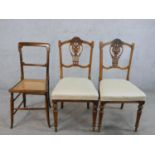 A pair of late 19th century walnut framed pierced splat back chairs, with stuff over seats, raised