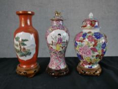 Three Chinese porcelain vases comprising of a possibly Republic period baluster vase with panels
