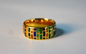 An 18 carat yellow gold multi coloured enamel brick pattern wide D-shape band. Stamped 585, AG. Size