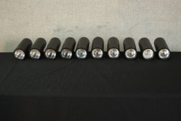 A set of ten cylindrical wall mounted electric studio/picture lights. H.23 W.8 D.22cm each