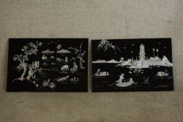 A 20th century pair of Chinese lacquered and mother of pearl inset rectangular wall plaques