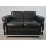 A contemporary Le Corbusier style black leather and chrome plated two seater settee, raised on tubul