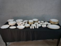 A Spode Fleur de Lys pattern part dinner and teaset comprising of plates, bowls, cups and saucers