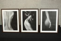 A set of three framed black and white photographs of nude females. H.43 W.33cm. (each)