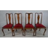 A set of four 19th century Queen Anne mahogany framed dining chairs with shaped splat backs and