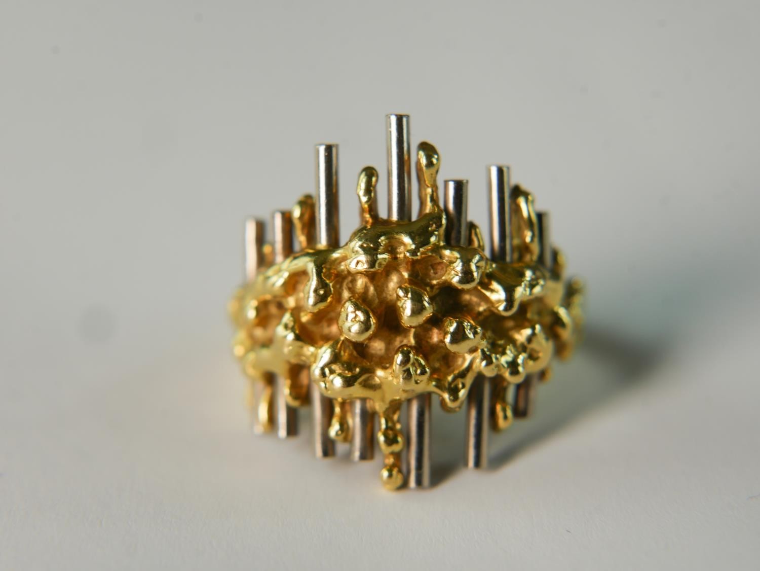 A mid 20th century David Thomas 18 carat yellow and white gold modernist design ring. Ring size O,