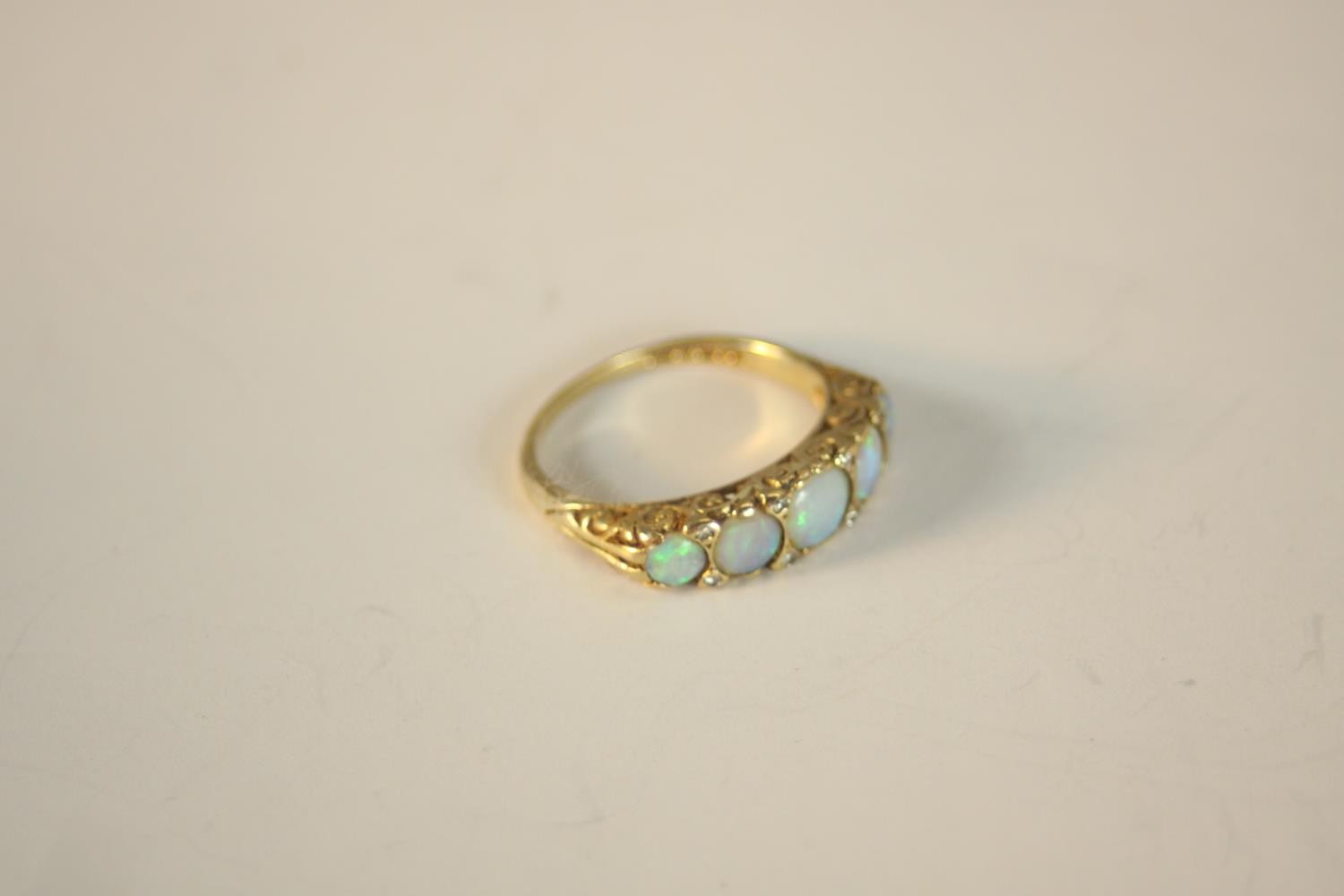 A 9ct carat yellow gold carved half hoop five stone Opal and diamond ring. Set with five round - Image 8 of 10