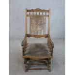 A 19th/early 20th century beech framed American style rocking chair.