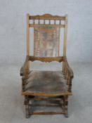 A 19th/early 20th century beech framed American style rocking chair.