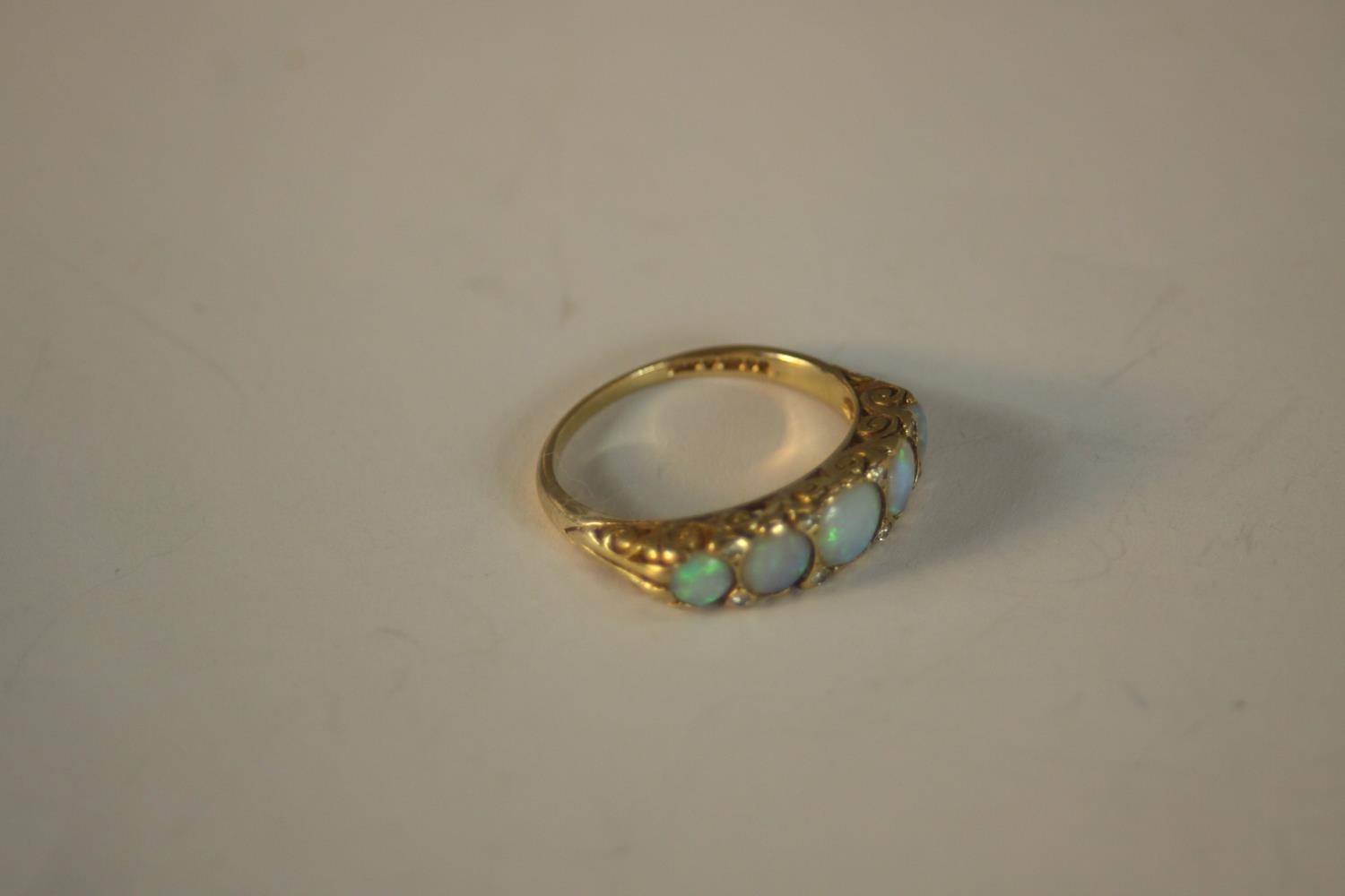 A 9ct carat yellow gold carved half hoop five stone Opal and diamond ring. Set with five round - Image 7 of 10