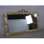 A 20th century gilt framed overmantle wall mirror. H.89 W.142cm
