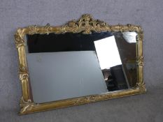 A 20th century gilt framed overmantle wall mirror. H.89 W.142cm
