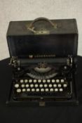 An early 20th century cased Underwood manual typewriter. H.12 W.31 D.26cm.