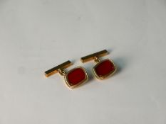 A pair of 9ct rose gold and carnelian chain link cufflinks, the bar with engraved linear design