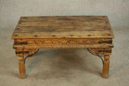 An late 20th century Eastern hardwood and cast iron raised on turned supports. H.44 W.90 D.53cm.