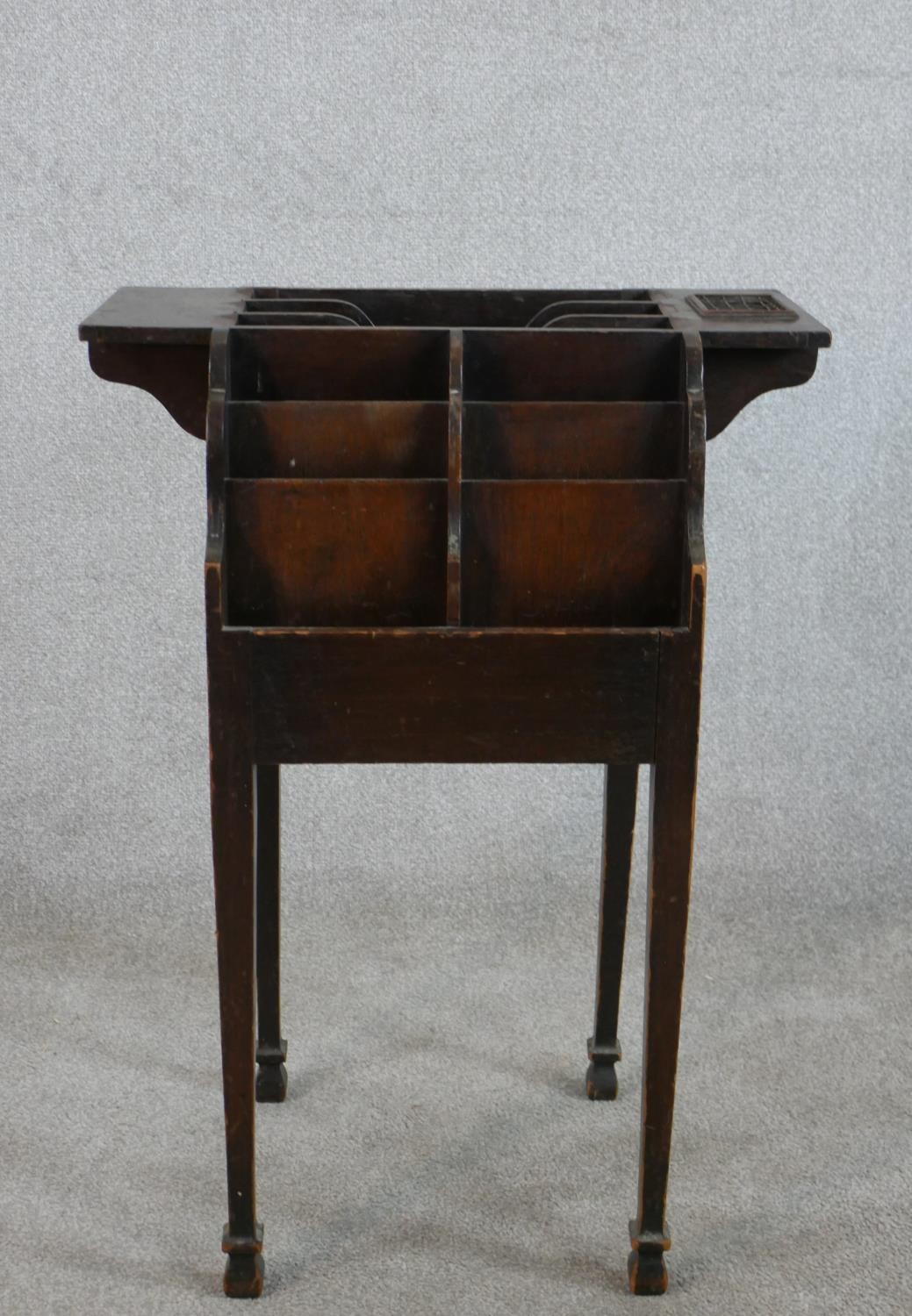 A 19th century leaflet or pamphlet stand, with a number of dividers, on square section tapering legs