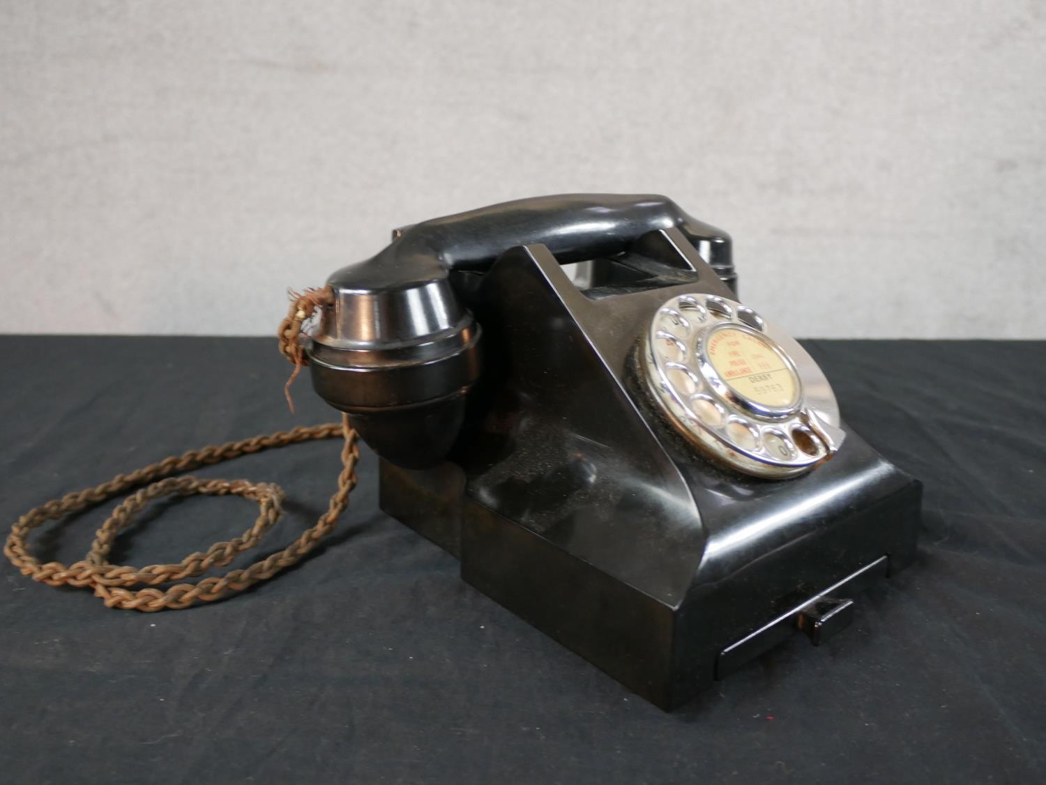A 1930s/1940s black Bakelite GPO telephone, with white metal dial and drawer. H.14 W.15 D.20cm - Image 5 of 7