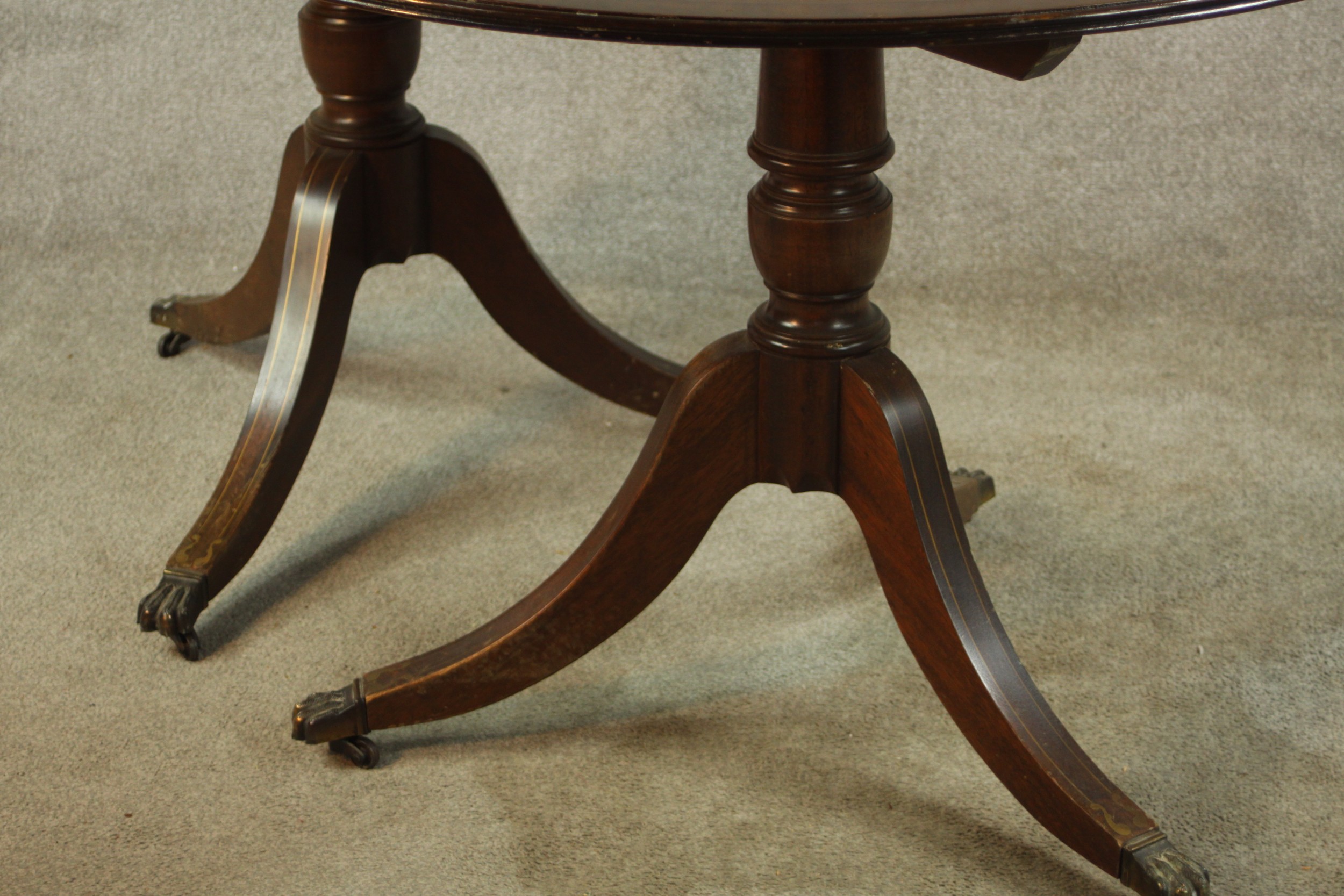 A 20th century Regency style mahogany twin pedestal dining table, raised on turned columns on tripod - Image 7 of 9