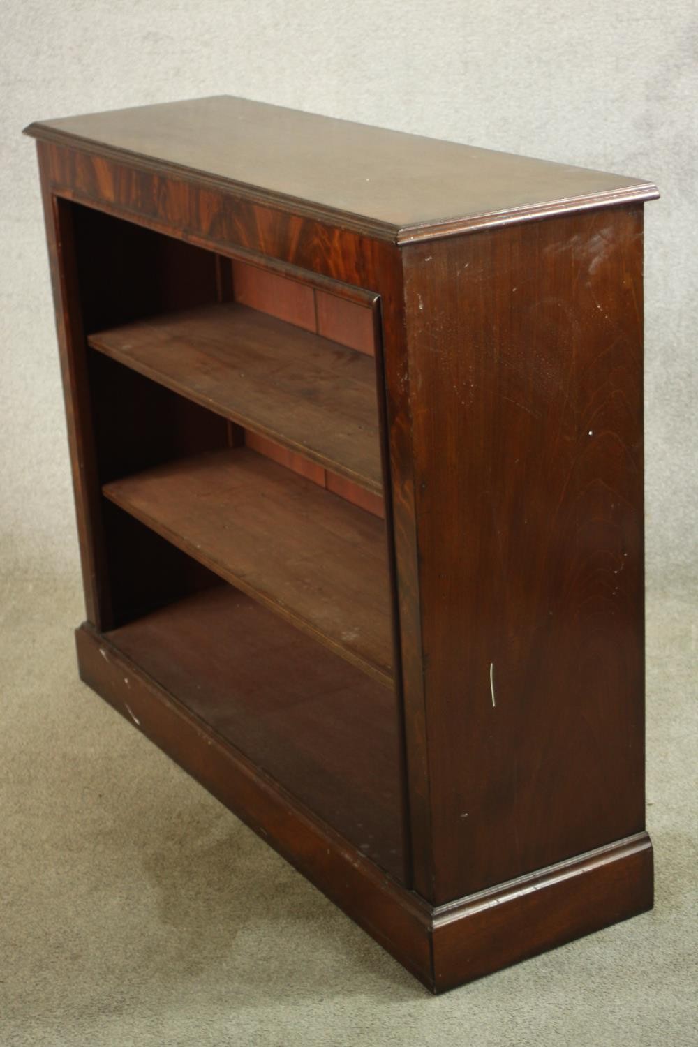 A 20th century mahogany three tier open bookcase, raised on block plinth base. H.102 W.121 D.38cm. - Image 5 of 7